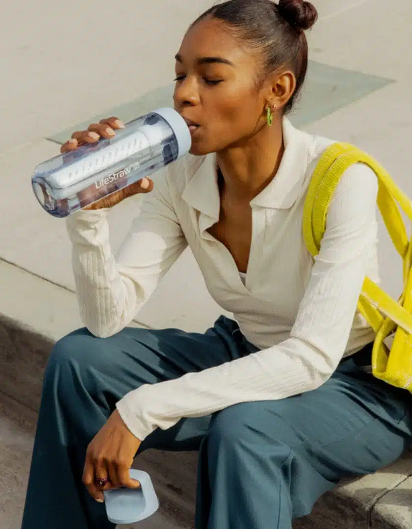 Woman drinking from LS Go Bottle