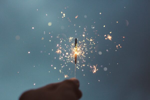 A lit sparkler celebrating the new year