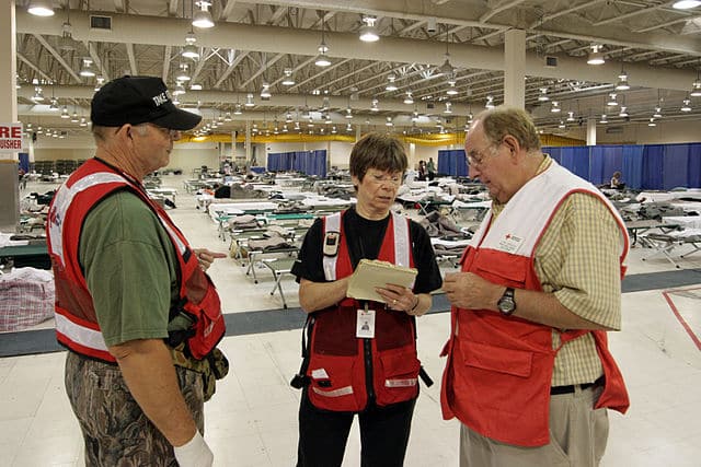 Red Cross members at a reception center for evacuations